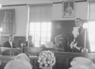 Photograph, Sir Dallas Brooks seated in council chambers at declaration of the City of Ringwood, 1960