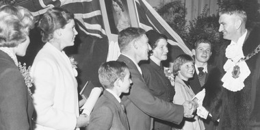 Photograph, Cr. Peter Vergers greets people who have just received their naturalisation papers. c1963