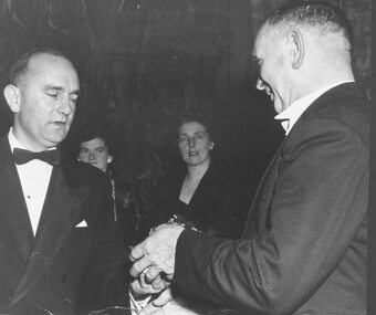 Photograph, Mr. Laurie McLeod presenting a watch to the Mayor of Ringwood at Mayoral Return Ball. c1961