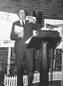 Photograph, Mr. Ken Horne, Latrobe Librarian, speaking at the launching of Hugh Anderson's book 'Place of Many Eagles', 1974