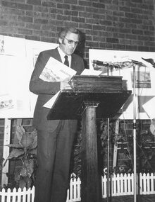 Photograph, Latrobe Librarian, Ken Horne speaking at the launching of Hugh Anderson's book 'Place of Many Eagles', 1974