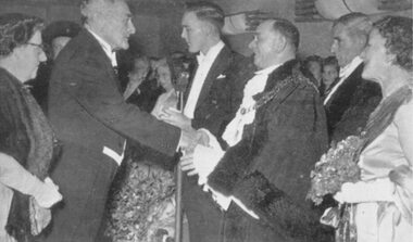 Photograph, Sir George and Lady Knox at Ringwood Mayoral Ball being greeted by Mayor Cr B. Hubbard. c1950's