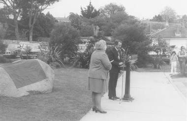 Photograph, Plaque unveiling at Ringwood Eastern Metropolitan Regional Library, commemorating the Golden Jubilee of Ringwood's severance from Lilydale. 1974. Mrs. E Pullin, Ringwood Historical Group President (left), and Mayor, Cr. Stan Morris