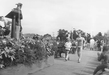 Photograph, "Back to Ringwood" celebrations at Ringwood Civic Centre - 19 October, 1974.  Mayor Cr. Stan Morris receiving "good will" messages from local athletes