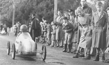 Photograph, Soap Box Derby, Warrandyte Road, Ringwood - 10/10/1953. "Silver Flash" from Northcote had a fairly comfortable win from Ringwood's "Lilbom'.  One of a number of a activities organised to raise funds by the Ringwood Pre-School Development Committee
