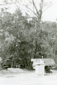 Photographs, 1979-80 MMBW pipe line project at Hubbard Reserve, North Ringwood � View behind no. 39 Burlock Avenue showing compressor, mole pit cover and the big box tree