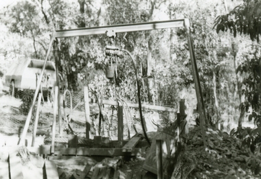 Photographs, 1979-80 MMBW pipe line project at Hubbard Reserve, North Ringwood � Air winch over the hole in the corner of Chalkley's