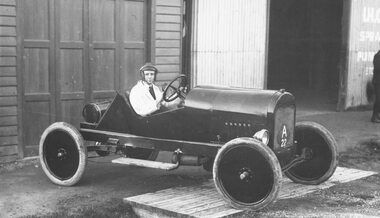 Photograph, Maroondah Highway East, Ringwood- 1925. L. Little and E. O'Keefe's racing car outside their garage near Pratt Street
