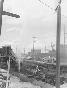Photograph, Maroondah Highway East, Ringwood- 1964. Water main repair work on the north-east corner of Maroondah Hwy and Warrandyte Road