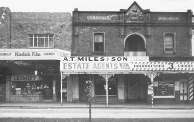 Photograph, Maroondah Highway Central, Ringwood. Coffee Palace and shops opposite Railway Station entrance- c1966