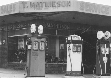 Photograph, Kerbside pumps at station entrance