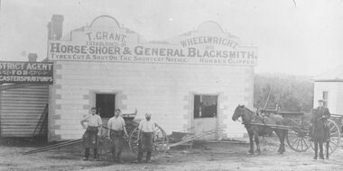 Photograph, Ringwood's first blacksmith, Tommy Grant, outside his second shop cnr Maroondah Highway and Adelaide Street, Ringwood - 1883