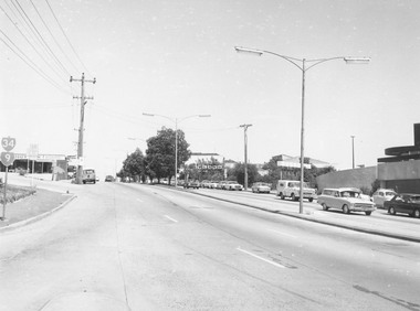 Photograph, Maroondah Highway, Ringwood, viewed from Warrandyte Road - 1974.  Bus and taxi access road to railway station on left
