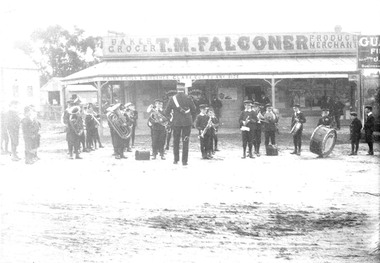 Photograph, Maroondah Highway Central, Ringwood. St. Vincent's de Paul band outside T. M. Falconer Store at Opening of Ringwood Mechanics Institute, 1909