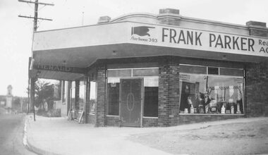 Photograph, Frank Parker Estate Agency sign over corner shops railway entrance Ringwood  (undated)
