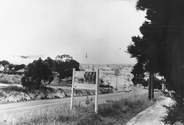 Photograph, Maroondah Highway West, Ringwood, 1969. "Why Ringbark Ringwood" sign near Heatherdale Road