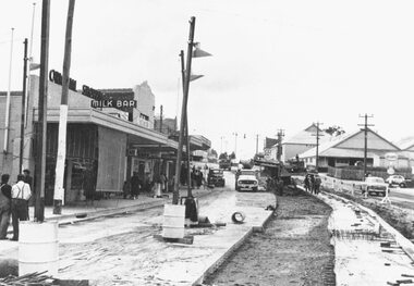 Photograph, Maroondah Highway West, Ringwood- c1958. Roadworks outside shopping centre strip near Wantirna Road