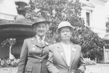 Photograph, Mrs. Parker and Mrs. Cribbes at Government House for Red Cross award (undated)