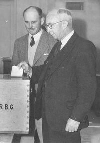 Photograph, H.F. Pearson (Mayor) and A.T. Miles (past Mayor) voting. 1949