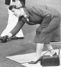 Photograph, Ringwood Bowling Club- Green Opening Day, 1960. Mrs. S. E. Dickens, wife of the club president throwing the kitty, 15/09/1960