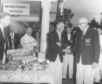 Photograph, Ringwood Bowling Club.  Mr. Bert Dear, Burwood receives first prize on behalf of J. Delaney.  K. McLellan, J. Gorman and J. Warner