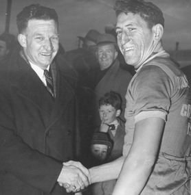 Photograph, Cr. A. Patterson (South Ward) congratulating winner of the '60' Ringwood Road Race. c1960's