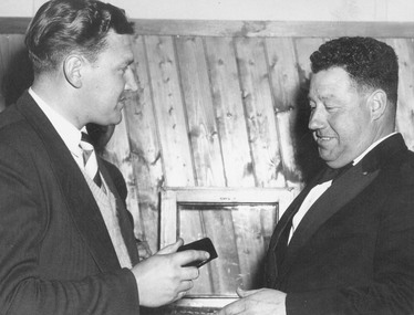 Photograph, East Ringwood Football Club: Lionel Johnston (Coach) receiving presentation from Mr. T. Reddish (Pres.). 1956