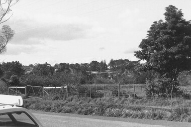 Photograph, Looking N.E. across Warrandyte Road 150 yards north of Oban Rd. at the houses around and SE of Parkwood High School 1981