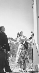 Photograph, Opening Jubilee Park- Mr. & Mrs. Beaumont, Ringwood Cricket Club unfurling flag. 1957