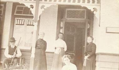 Photograph, Mr & Mrs Carr and others on verandah of Carr house. (Undated)