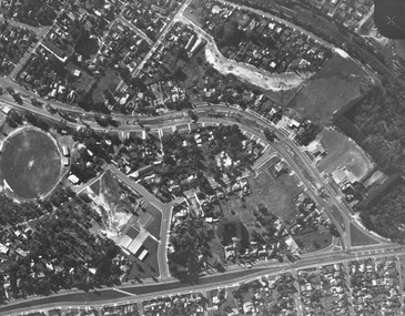 Photograph, Aerial view showing East Ringwood oval, Mount Dandenong Road, and Civic Centre, Braeside Avenue/Maroondah Hwy, c.1970