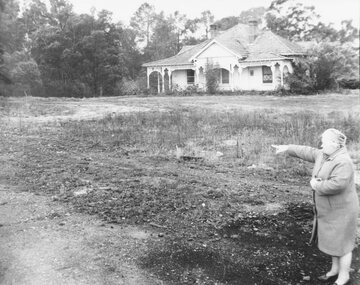 Photograph, Mrs. E.V. Pullin, Chairman Library Promotion Committee pointing to new library site - 1967 - opposite Eastland and the bowling green, Warrandyte Road.  Five photographs