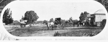 Photograph, Mount Dandenong Road, Ringwood. Blood's store on right, Club Hotel behind tree, Cornell's store on left. c.1900-1910