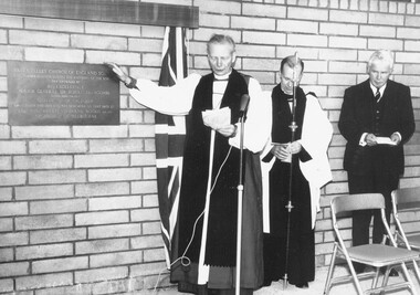 Photograph, Archbishop Frank Woods (left) and Sir Rohan Delacombe (right) pictured at Ringwood's Yarra Valley Church of England School dedication - October, 1965.  The inscription on the plaque reads, "Yarra Valley Church of England School.  This plaque commemorating the founding of the school was unveiled by His Excellency Major General Sir Rohan Delacombe, Governor of Victoria on October 2nd 1965 and was dedicated on that date by the Most Reverend Frank Woods, M.A., D.D., Archbishop of Melbourne"
