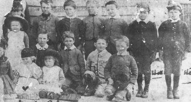 Photograph, Incomplete torn photograph (origin unknown) of pupils at Cass' School, Ringwood - 1887, including (front) - Marie Herry and Robina Lindsay, (kneeling, right) - Leo Herry, and two Hills' standing on right