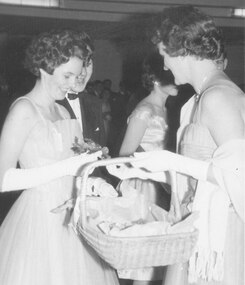 Photograph, Ringwood High School's first ball.  Miss White, one of the finalists, picking her bouquet in the Belle of the Ball dance.  (Ringwood Mail newspaper article - 18/8/1960)