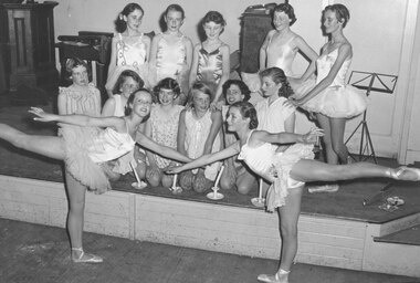Photograph, (Ringwood Mail newspaper article - 9/1/1958) Ringwood High School. Scene from the ballet.  L-R Back Row Standing: 1. D. Close, 2. J. Baker, 3. ?, 4. ?, 5. ?.  Middle Row: 1. S. Pickford, 2. ?, 3. B. Beatie, 4. ? Williams, 5. Sheryl Gogly, 6. ?.  Front: 1. Julie Doitry, 2. Pam Deuter