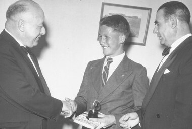 Photograph, Ringwood High School Principal - Mr J. Bennett and guest congratulate 1955 Dux of School and swimming champion, Victor Greenham ('Mail' 12/1/56)