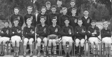 Photograph, Ringwood High School Junior Football Team, 1960. (Left to right) - Front Row: A. Hancy, L. Smith, C. Pavey, J. McCubbin, T. Hancock, D. Baud, G. Anderson, P. Stevens, J. Reid.  Middle Row: W. Pole, L. Prior, C. Healey, J. Stuchberry, T. Noy, A. Gray, G. Saines.  Back Row: P. Fletcher, B. Moore, G. Sinclair