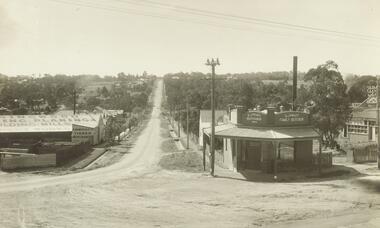 Photograph, Warrandyte Rd (unmade) Ringwood.  O.J. Pratt shop on corner.  Benty's timber yard on right  (Undated)