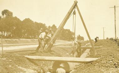 Photograph, Laying pipeline near Mt. Dandenong Road, in Whitehorse Road, Ringwood (undated)