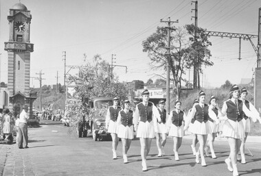 Photograph, Scout Carnival - March 1959.  Hampton Marching Girls leading procession past Ringwood Clock Tower