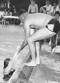 Photograph, Ringwood Baths, 1957.  Harold Walklate demonstrating correct method of lifting patient out of water