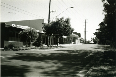 Photograph-B&W, Joan Walker, East Ringwood 2000- Railway Avenue looking West (Kirby Homecare,Wright Bros.Op Shop,& Bike Shop), 2000