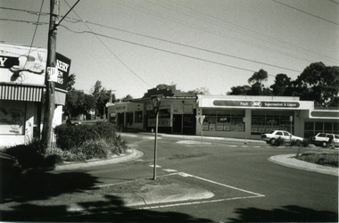 Photograph-B&W, Joan Walker, East Ringwood 2000-Roundabout in Railway Avenue cnr Wenwood Street looking West (Bakery,Paul's IGA), 2000