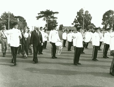 Photograph, Official opening of the Karralyka Centre, Mines Road, Ringwood on 19/4/1980 - Cr. Pat Gotlib (Mayor) and Victorian Governor Sir Henry Winneke inspecting the army band, 19-Apr-80