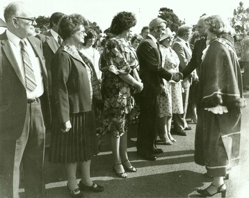 Photograph, Official opening of the Karralyka Centre, Mines Road, Ringwood on 19/4/1980 - Cr. Pat Gotlib (Mayor) and Victorian Governor Sir Henry Winneke greeting dignitaries - shaking hands with Cr. Bill Wilkins, 19-Apr-80