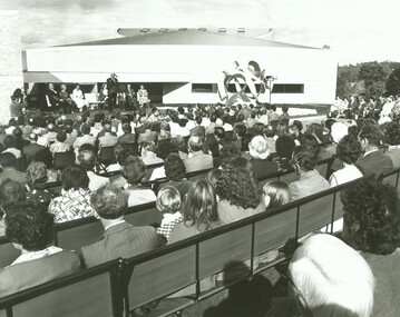 Photograph, Official opening of the Karralyka Centre, Mines Road, Ringwood on 19/4/1980 - Victorian Governor Sir Henry Winneke addressing the gathering.  Theatre in the background, west side, 19-Apr-80