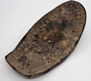 Footwear - Sole of Shoe, Leather sole of shoe with a nail through the middle. Undated, <2000