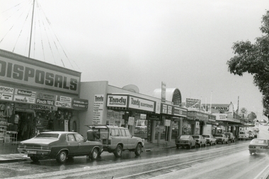 Photograph, Maroondah Highway, Ringwood on 12 September 1988, showing Ringwood Disposals, Tandy Electronics, TAB and other shops going up to Ringwood Street